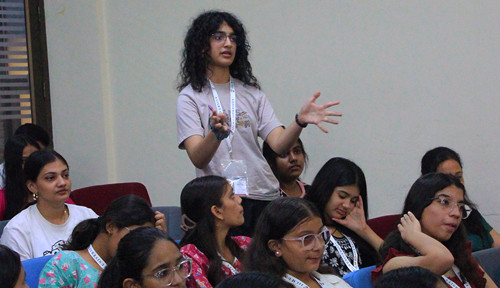 Students pitching ideas in a presentation setting
