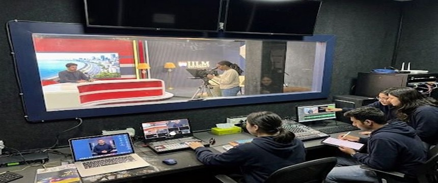 Control Room Viewing Window into Studio with Camera Crew